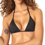 Close up shot of woman wearing a black bikini top on a white background