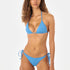 Woman wearing a blue bikini on a white background